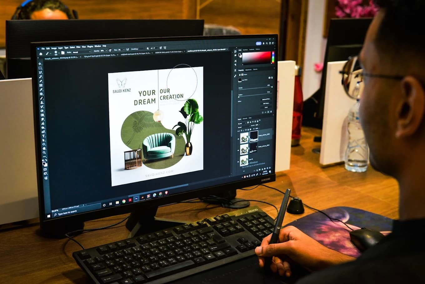 Designer working in Photoshop on Saudi client project