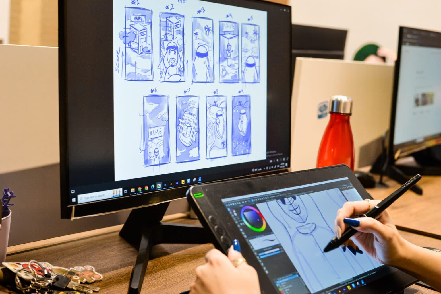 Designer working on storyboard with drawing tablet