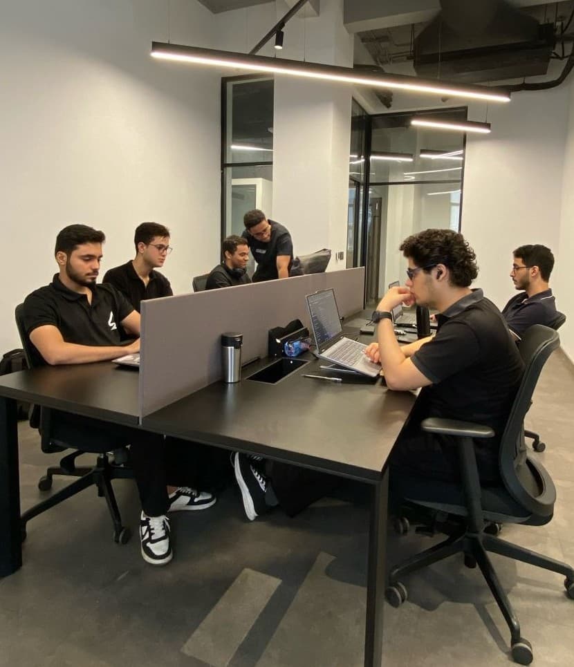 Eclipse Agency team in black polos at modern office